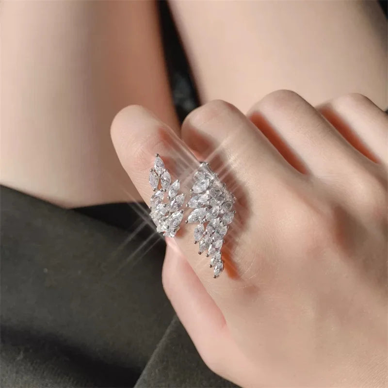 ZAKOL Fashion White Zirconia Leaf Open Rings for Girl Trendy Crystal Wing Finger Adjust Ring Party Women Jewelry