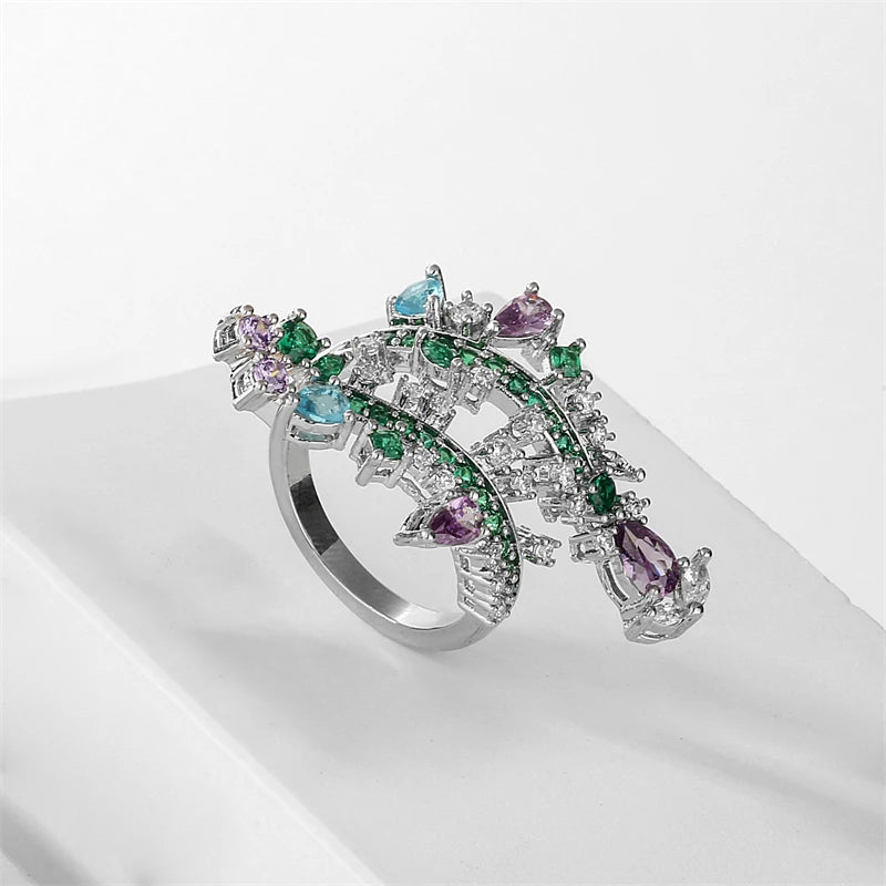 ZAKOL Fashion White Zirconia Leaf Open Rings for Girl Trendy Crystal Wing Finger Adjust Ring Party Women Jewelry
