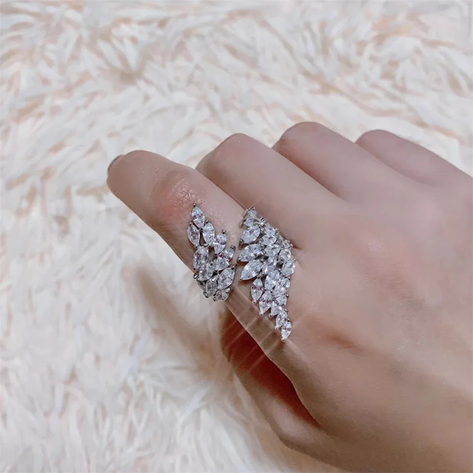 ZAKOL Fashion White Zirconia Leaf Open Rings for Girl Trendy Crystal Wing Finger Adjust Ring Party Women Jewelry