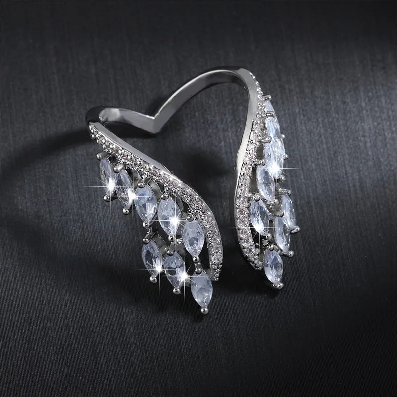 ZAKOL Fashion White Zirconia Leaf Open Rings for Girl Trendy Crystal Wing Finger Adjust Ring Party Women Jewelry